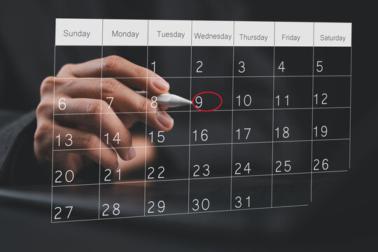 Businesswoman manages time for effective work. Calendar on the virtual screen interface. Highlight appointment reminders and meeting agenda on the calendar. Time management concept.