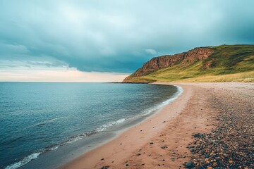 Obraz premium A serene sunset scene over the ocean on a cloudy day, perfect for travel or nature-themed projects. Beautiful simple AI generated image