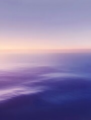 Fototapeta premium A serene seascape featuring tranquil ocean waters reflecting soft pastel colors of dusk. The calmness invites a soothing and peaceful mood, perfect for relaxation.
