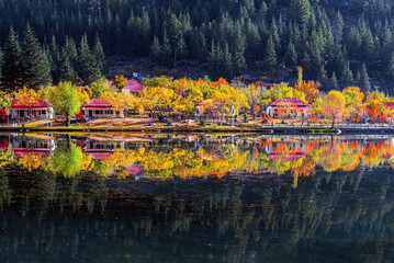 shangrila resort and lower kacura lake in autumn with reflection in calm water 