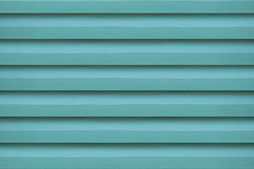 Obraz premium The close-up of the green wooden vent lattice, highlights its intricate design, providing a vibrant background.