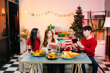 Holiday spirit with Asian friends exchanging gifts, sharing laughs, and enjoying a festive Christmas dinner