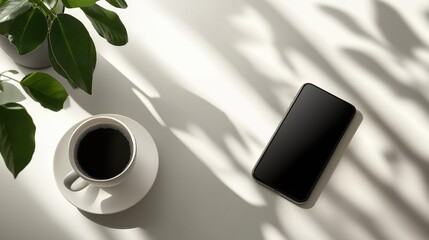 A serene morning unfolds with a cup of steaming coffee beside a sleek smartphone, basking in soft sunlight that creates intricate shadow patterns on a white table.