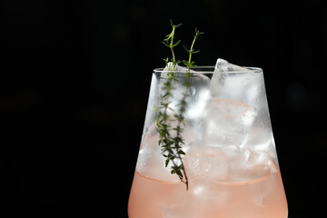 Mediterranean Spritz Cocktail with sweet vermouth, wine, thyme prosecco and ice cubes