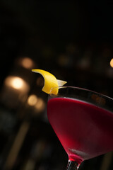 Manhattan cocktail glass on a marble table background with copy space, close-up