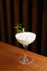 Cocktail with gin, creme rose, egg white bitters