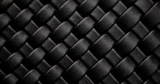 Black Leather Woven Texture. Close-up of a black leather woven pattern with a luxurious, textured finish. Perfect for backgrounds, fashion themes, and design elements with an elegant.