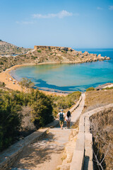 Scenic viewpoint over Riviera Beach, Ghajn Tuffieha Bay and Qarraba Bay with red sand. Mgarr, Malta island. 