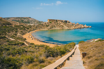Scenic viewpoint over Riviera Beach, Ghajn Tuffieha Bay and Qarraba Bay with red sand. Mgarr, Malta island. 