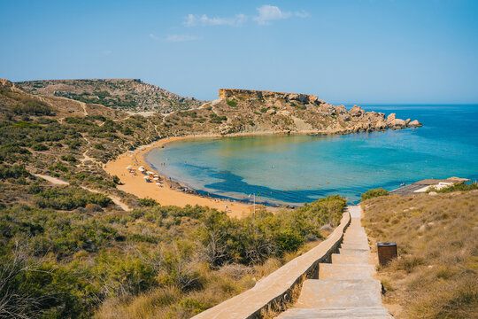 Scenic viewpoint over Riviera Beach, Ghajn Tuffieha Bay and Qarraba Bay with red sand. Mgarr, Malta island. 