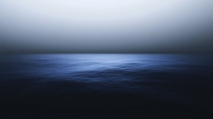 Obraz premium Calm ocean waves under a serene blue sky with a smooth gradient.