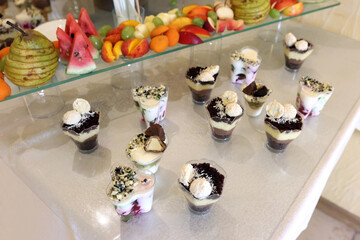 Pastries, mousses and various sweets for the festive buffet table.