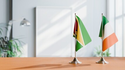 FLAGS OF GUYANA And IRELAND ON TABLE