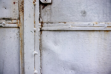 Detail of metal gate joint. Rust in the joints of the structure and iron plates. Background, texture, metal gate, joint detail, construction, weld, color, rust.