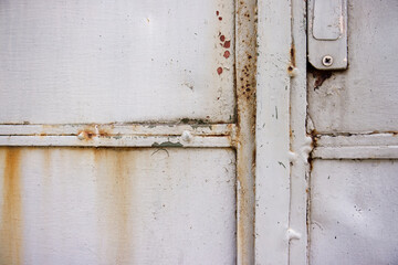 Detail of metal gate joint. Rust in the joints of the structure and iron plates. Background, texture, metal gate, joint detail, construction, weld, color, rust.