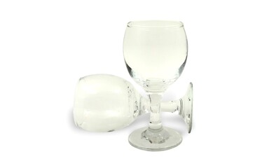 Photo of two small wine elegant glasses, isolated against a clean white background.