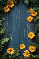Obraz premium Vibrant yellow flowers framed by lush green foliage on a rustic blue wooden background perfect for nature lovers and floral enthusiasts