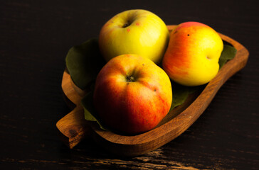 fresh apples served on a wooden board