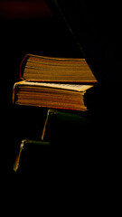 aged books stacked darkness