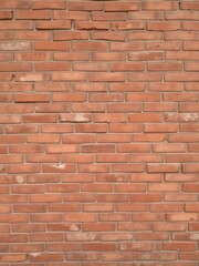 Obraz premium A weathered red brick wall forming a rustic background, design