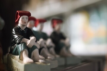 Sitting Samsui woman ceramic figurine