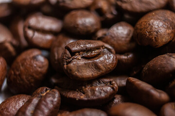 Macro photography Coffee beans artistic shot, brown bean, arabica and robusta, café, caffeine, white background, freshness, shot is selective focus with shallow depth of field, taken at Cairo Egypt