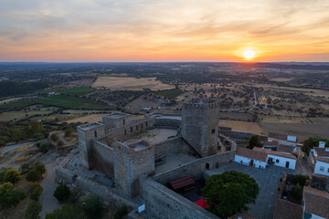 Obraz premium Amazing aerial view of the medieval village of Monsaraz, Alentejo, Portugal. Beautiful landscape at sunset. Historic castle, tourist attraction and holiday travel destination.