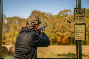 clay shoot, gun, rifle, shooting, weapon, hunter, aiming, shotgun, target, sniper, hunting, soldier, shoot, aim, military, shot, person, people, shooter, war, army, armed, woman, sport, camouflage, na © mark