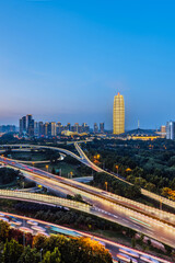 Naklejka premium Night view of CBD and overpass in Zhengdong New District, Zhengzhou, Henan Province, China