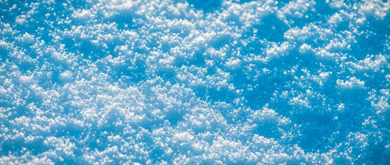 Natural snow background, snow glitters and shimmers like a rainbow in the sun, natural snow texture