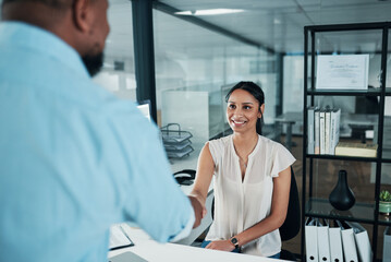 Business people, handshake and meeting with colleague at office for partnership, deal or introduction. Businessman, woman or employees shaking hands with smile for agreement or teamwork at workplace