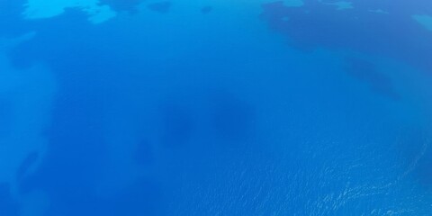 Obraz premium A stunning aerial view of crystal clear blue waters of the ocean, surrounded by lush tropical islands, vacation, aerial view