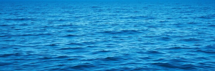 A serene ocean background with clear blue water, gently rolling waves, and a distant horizon under a clear blue sky, sea, scenery
