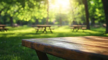 Fototapeta premium Picnic Table in a Park with a Soft Focus on Sunlit Trees in the Background