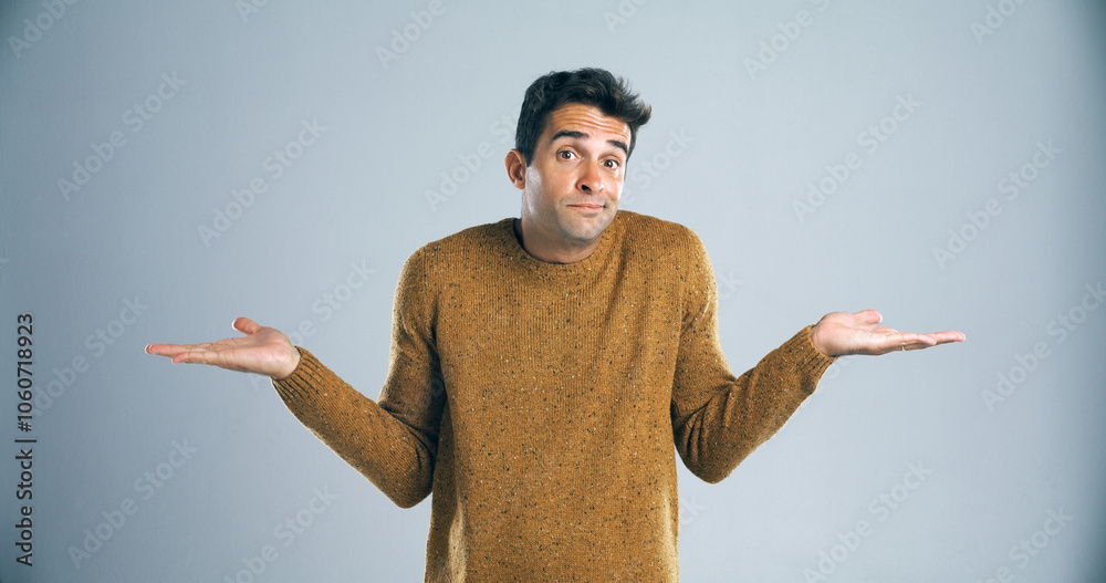 Poster Man, portrait and unsure with hands in studio for question, confused or doubt with decision on mockup space. Person, choice or scale for options with comparison, shrug or uncertain on gray background