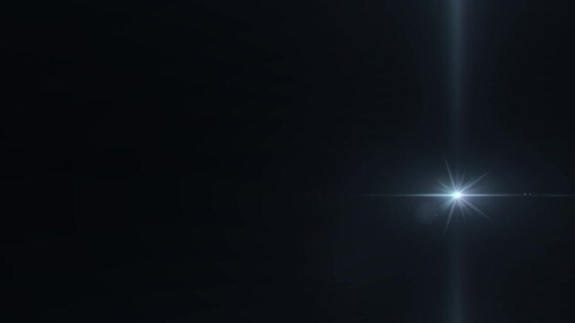 Abstract	sparkles camera flash. Lens flare light overlay effect on black background.