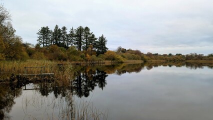lakeside landscape scenery, jetty at Ballyqiurke lough, Moycullen, Galway, Ireland, nature background	