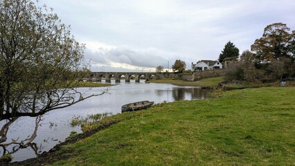 Old wooden fishing boat in river Shannon at Shannonbridge, Offaly, Ireland, nature background