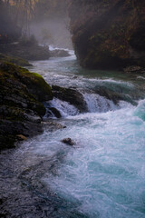 gorge with a river in the mountains, blue water, blue river, waterfalls, rocks and mountains
