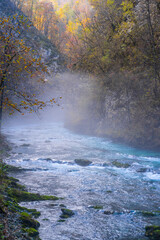gorge with a river in the mountains, blue water, blue river, waterfalls, rocks and mountains