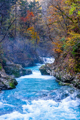 gorge with a river in the mountains, blue water, blue river, waterfalls, rocks and mountains