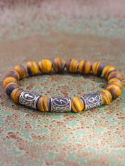 Black Obsidian stone bracelet , Chinese men's modern retro style fashion. Isolated on white...