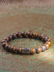 Black Obsidian stone bracelet , Chinese men's modern retro style fashion. Isolated on white...