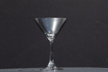 empty martini glass on dark background