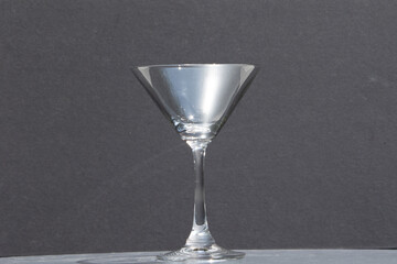 empty martini glass on dark background