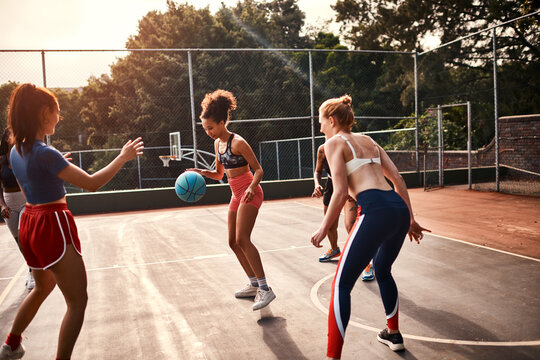 Women, team and ball on basketball court as athlete or player for challenge, cardio and training. Female people, warm up and outdoor for competition, match and sports in physical activity or exercise