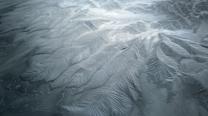  Icy Patterns on Frozen Surface Resembling Mountain Ridges