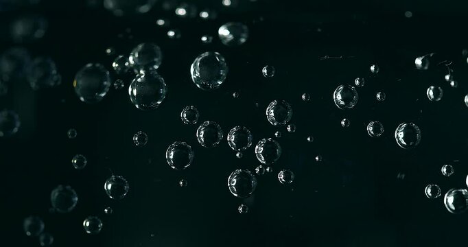 Water bubbles on black, dark background, interactive, real footage