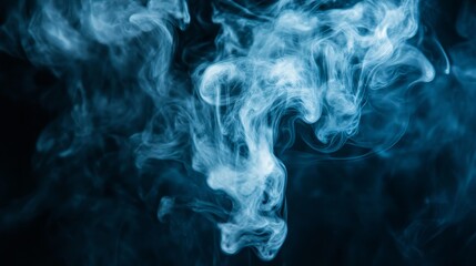 Fototapeta premium A swirling pattern of blue smoke against a dark background, creating an ethereal atmosphere.