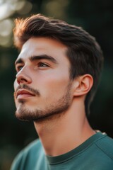 Fototapeta premium A young male with a beard gazing at the camera.